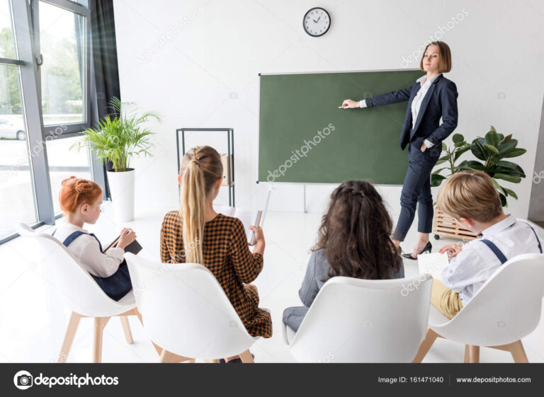 depositphotos_161471040-stock-photo-teacher-explaining-lesson-to-students